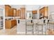 Modern kitchen with wood cabinets, granite countertops, and stainless steel appliances at 5515 Citation Ct, Lady Lake, FL 32159