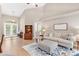 Bright living room with vaulted ceilings, hardwood floors, and comfortable seating at 5515 Citation Ct, Lady Lake, FL 32159