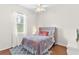 Cozy bedroom featuring a double bed and hardwood floors at 5515 Citation Ct, Lady Lake, FL 32159