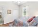 Well-lit bedroom with a double bed and hardwood floors at 5515 Citation Ct, Lady Lake, FL 32159