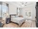 Serene bedroom with a comfortable bed and access to a private patio at 5515 Citation Ct, Lady Lake, FL 32159