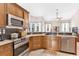 Updated kitchen with stainless steel appliances and granite countertops at 5515 Citation Ct, Lady Lake, FL 32159