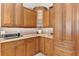 Kitchen features many cabinets and granite countertops at 5515 Citation Ct, Lady Lake, FL 32159