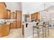Updated kitchen with wood cabinets, granite countertops, and stainless steel appliances at 5515 Citation Ct, Lady Lake, FL 32159