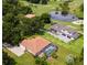 Two homes, one with a pool, overlooking a golf course and pond at 5515 Citation Ct, Lady Lake, FL 32159