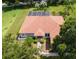 Single-story home with a brown roof, pool, and large backyard at 5515 Citation Ct, Lady Lake, FL 32159