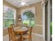 Kitchen breakfast nook with view of backyard and golf course at 32915 Crooked Oaks Ln, Leesburg, FL 34748