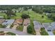 Aerial view of homes and golf course community at 32915 Crooked Oaks Ln, Leesburg, FL 34748