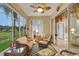 Relaxing sunroom with wicker furniture and views at 32915 Crooked Oaks Ln, Leesburg, FL 34748