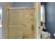 Walk-in shower with a seat and safety bar at 32915 Crooked Oaks Ln, Leesburg, FL 34748