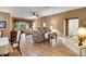 Living room with hardwood floors and seating area at 32915 Crooked Oaks Ln, Leesburg, FL 34748