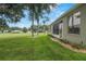 Home's exterior with a view of the golf course at 32915 Crooked Oaks Ln, Leesburg, FL 34748
