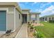 Front entry with walkway and landscaping at 32915 Crooked Oaks Ln, Leesburg, FL 34748
