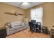 Home office featuring a desk and relaxing sofa at 32915 Crooked Oaks Ln, Leesburg, FL 34748