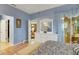 Main bedroom with light walls and a dresser with mirror at 32915 Crooked Oaks Ln, Leesburg, FL 34748