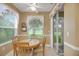 Bright breakfast nook with slider to backyard and golf course view at 32915 Crooked Oaks Ln, Leesburg, FL 34748