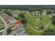 Aerial view of house on golf course community at 32915 Crooked Oaks Ln, Leesburg, FL 34748