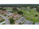 Aerial view of homes and golf course community at 32915 Crooked Oaks Ln, Leesburg, FL 34748