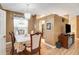 Bright dining room features a table with chairs and hardwood floors at 32915 Crooked Oaks Ln, Leesburg, FL 34748