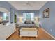 Bright bedroom with a queen-size bed and white furniture at 32915 Crooked Oaks Ln, Leesburg, FL 34748