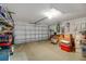 Attached garage with ample storage space and shelving at 32915 Crooked Oaks Ln, Leesburg, FL 34748
