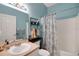 Updated bathroom with tub/shower combo and neutral decor at 32915 Crooked Oaks Ln, Leesburg, FL 34748