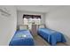 Bedroom with twin beds and ample closet space at 736 Jones Ln, The Villages, FL 32163