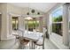 Bright and airy dining area adjacent to a window with backyard views at 2411 Adelphi Ave, The Villages, FL 32162