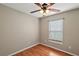 Bedroom with ceiling fan and wood flooring at 11712 Layton St, Leesburg, FL 34788