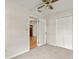 Bright bedroom with neutral walls, carpet, and access to hallway at 19402 E 5Th St, Umatilla, FL 32784