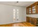 Charming dining room with hardwood floors and built-in hutch at 19402 E 5Th St, Umatilla, FL 32784