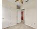 Bedroom with neutral walls, carpet, and a view of hallway at 19402 E 5Th St, Umatilla, FL 32784