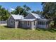 Aerial view showcasing the house's rear and side at 19402 E 5Th St, Umatilla, FL 32784