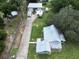 Aerial view showing house, detached garage, and large yard at 19402 E 5Th St, Umatilla, FL 32784