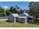 Aerial view showcasing the house's rear and side at 19402 E 5Th St, Umatilla, FL 32784