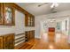 Bright dining room features hardwood floors and built-in cabinetry at 19402 E 5Th St, Umatilla, FL 32784