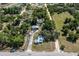 Wider aerial showcasing the home and neighborhood at 19402 E 5Th St, Umatilla, FL 32784