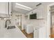 Renovated kitchen boasts white shaker cabinets and quartz countertops at 19402 E 5Th St, Umatilla, FL 32784