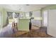 Kitchen with breakfast bar, view of backyard, needs new flooring at 10367 Se Sunset Harbor Rd, Summerfield, FL 34491