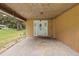 Front entryway with white door and concrete porch at 10367 Se Sunset Harbor Rd, Summerfield, FL 34491