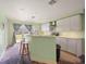 Kitchen with island and updated cabinets, new flooring needed at 10367 Se Sunset Harbor Rd, Summerfield, FL 34491