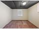 Simple bedroom with wood floors and a window with blinds at 10367 Se Sunset Harbor Rd, Summerfield, FL 34491