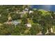 Aerial view of property with canal, neighboring houses, and lake at 10367 Se Sunset Harbor Rd, Summerfield, FL 34491