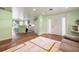 Living room with entryway and kitchen views, new flooring needed at 10367 Se Sunset Harbor Rd, Summerfield, FL 34491