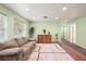 Bright living room with hardwood floors and light walls at 10367 Se Sunset Harbor Rd, Summerfield, FL 34491