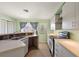 Kitchen with updated cabinets and appliances, needs new flooring at 10367 Se Sunset Harbor Rd, Summerfield, FL 34491