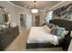 Spacious main bedroom with large bed, dresser, and walk-in closet at 10068 Fiddley Aly, Orlando, FL 32827