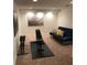 Finished basement with weight bench and futon at 124 Orange Ave, Clermont, FL 34711