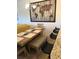Bright dining area with a rustic wooden table and bench seating at 124 Orange Ave, Clermont, FL 34711