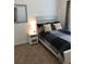 Cozy bedroom featuring a comfortable bed and modern nightstand at 124 Orange Ave, Clermont, FL 34711